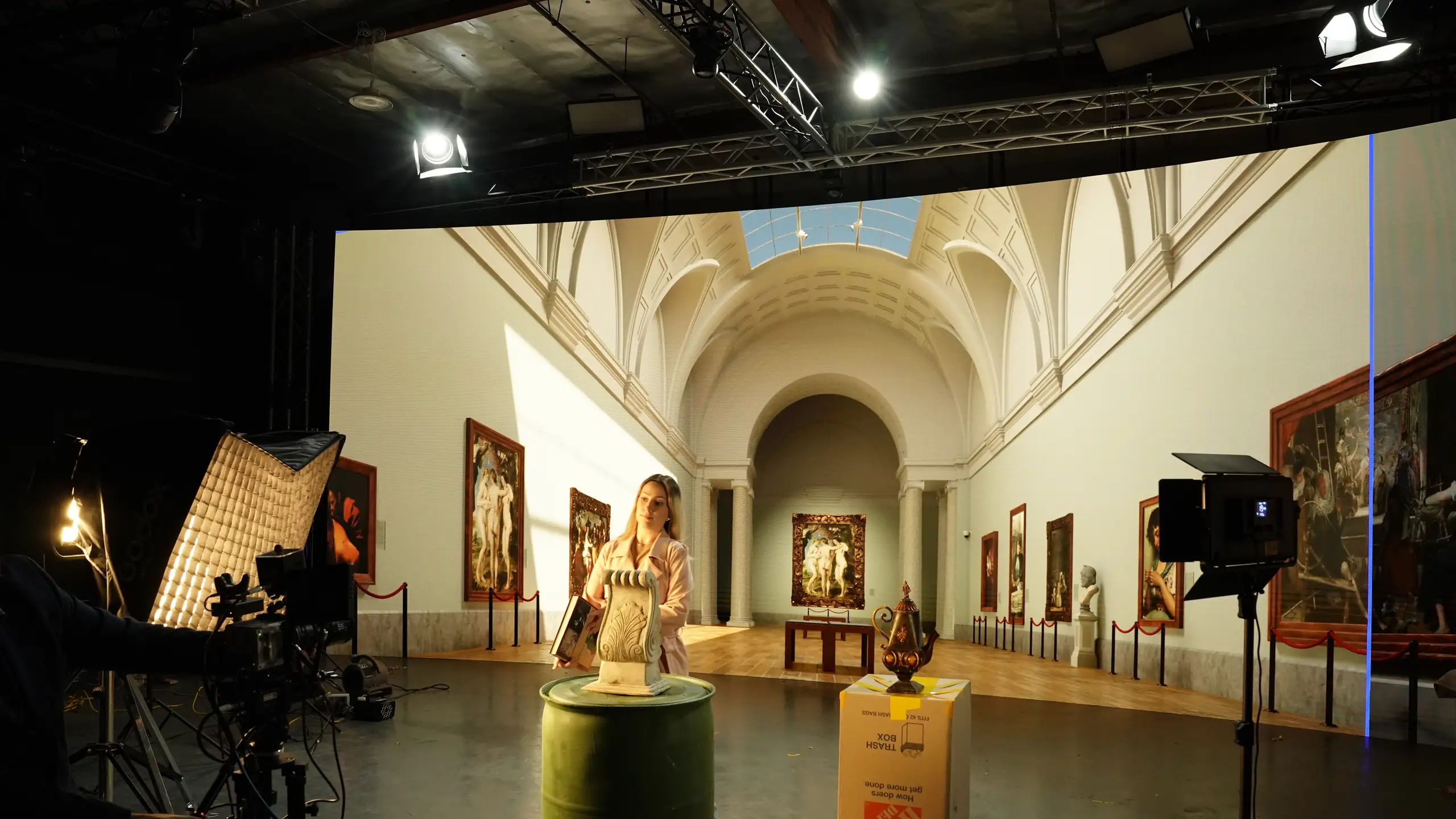 Virtual production shoot on PixelPro's curved LED stage in Anaheim, the wall showing a museum gallery, camera and lighting in the foreground