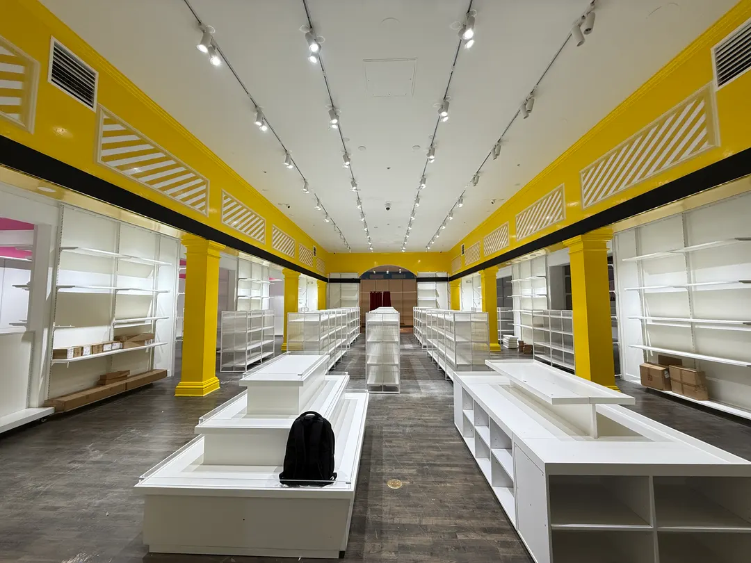 The LED strip along the top of the shelving, before the stock went in