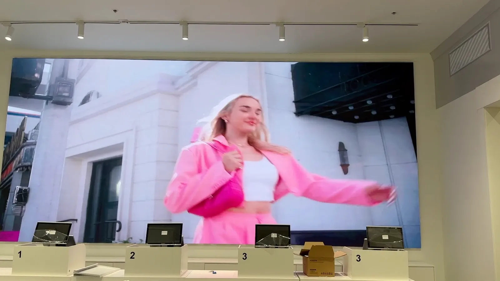 Miniso University Ave, Palo Alto, October 2024: the 6.4 × 2.88 m wall behind the tills, before opening