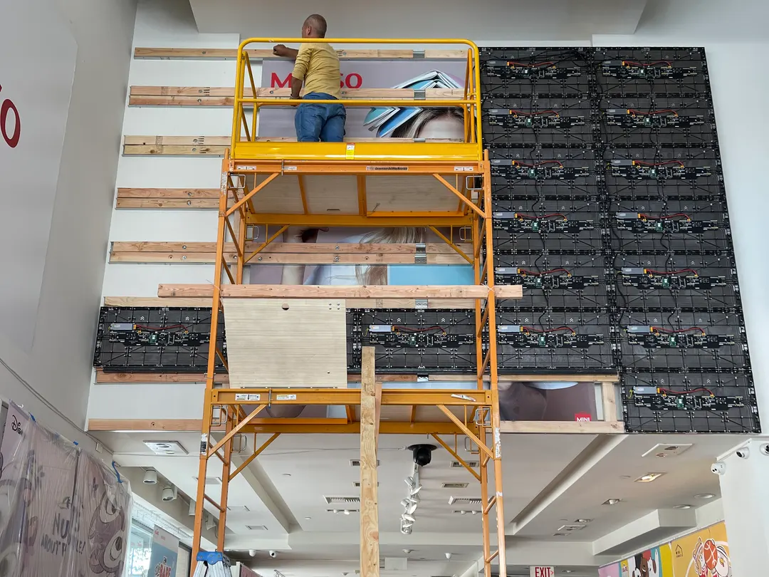 Cabinets going up from the scaffold, September 2023