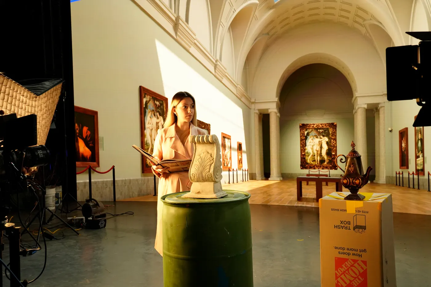On camera, the actor is standing in the gallery