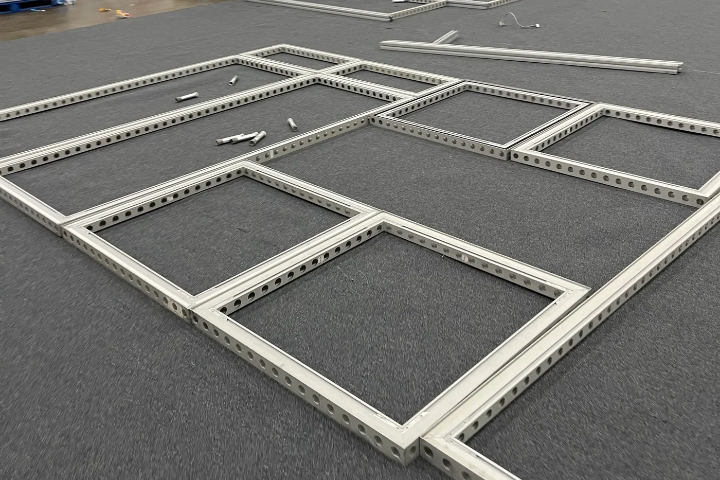 June 30, 2025: booth frames laid out on the hall floor