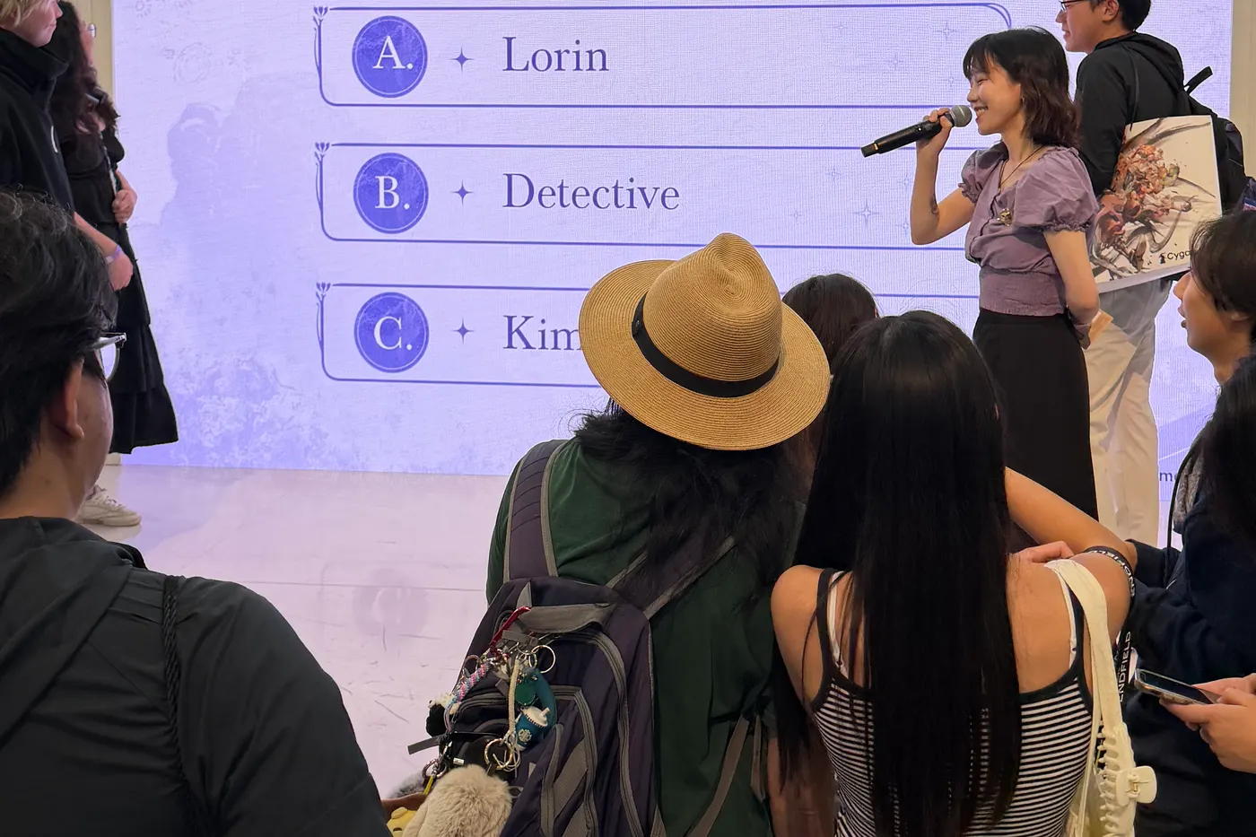 July 2, 2026: an on-stage quiz on a booth wall