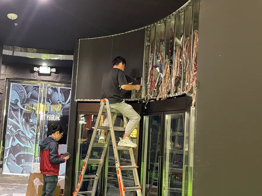 March 3, 2024: modules going onto the curved frame over the meat display