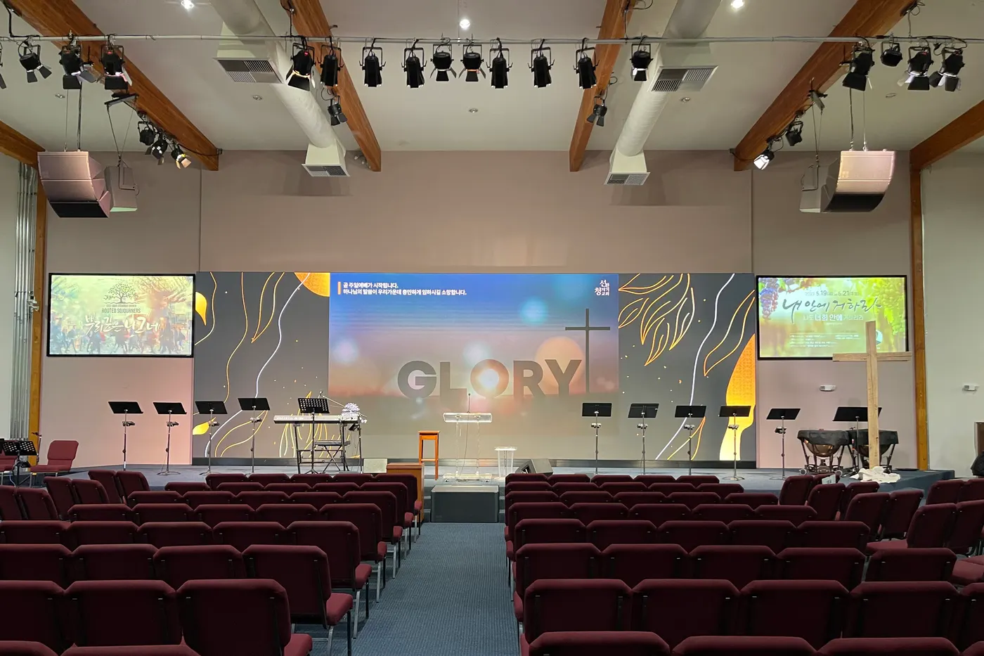 The original projection screens, now supporting displays either side of the LED wall