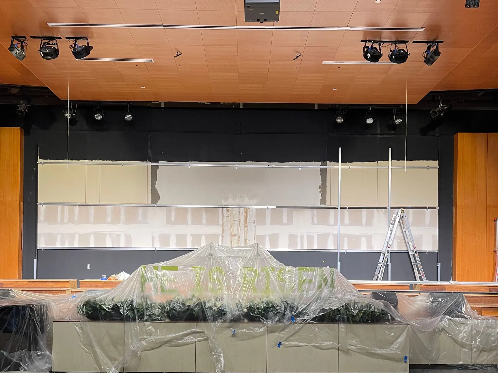The aluminium frame across the back wall, before the cabinets