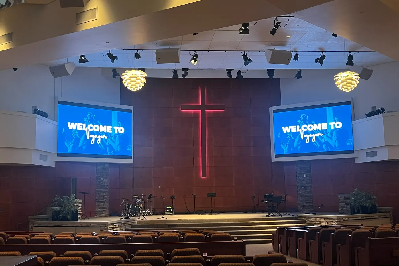 Two LED screens either side of the cross wall in a church in Irvine, California