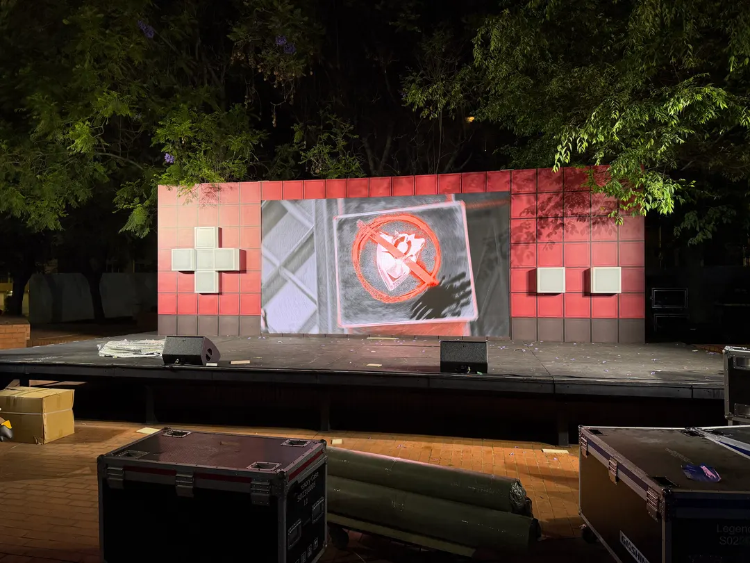 The same evening: the wall lit for a test after dark