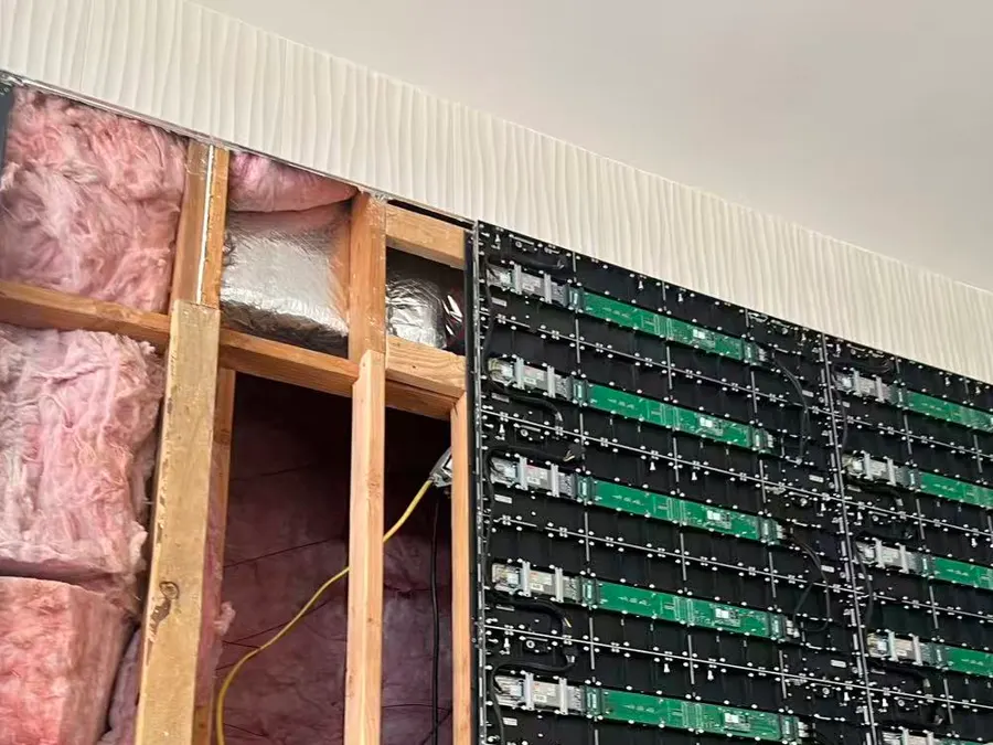Behind the wall board: the wood studs, with the first cabinets fixed straight onto them